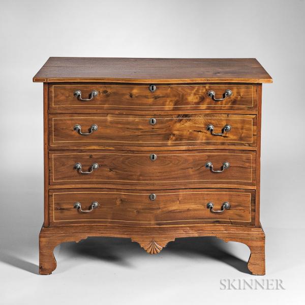Carved and Inlaid Mahogany Reverse Serpentine Chest of Four Drawers